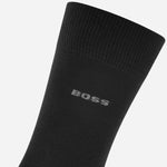 Close up of the BOSS logo on a sock from the BOSS 2-Pack Black Cotton Blend Regular Length Socks with Gift Set Bag.