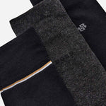 Close up of the logos on the BOSS 3-Pack of Black and Grey Socks with Logo Gift Set.