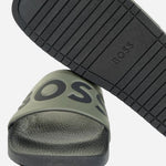 Bottom of the Aryeh Open Green Italian Made Slides with Large Black Logo.