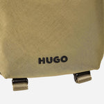 The HUGO logo on the front of the BOSS Ayden Green NS Zip Cross Body Bag with Raised Hugo Logo.