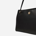 The double ‘B’ monogram on the front of the Beyond Black Grained Leather Tote Bag with Double 'B' Monogram.