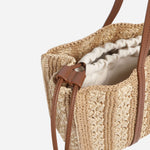 Side view of the BOSS Beyond Raffia Tote Bag with Brown Trims and Double 'B' Monogram Logo.