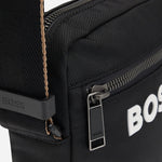 Close up of the BOSS Catch 3.0 Black NS Zip Top Cross Body Bag with Raised White Logo.