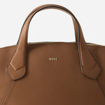 Close up of the BOSS Lenah Brown Zip Tote Bag with Metal Logo.