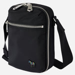 Side view of the Paul Smith Black Recycled Polyester Small Flight Bag with Signature Stripe Zebra Logo.