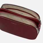 Inside the Dukes Place Carmine Leather Medium Zip Top Cross Body Bag.