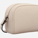 Side view of the Radley The Daily Salt Leather Small Zip Around Cross Body Bag.