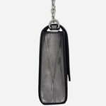 Side view of the The Rathbone Silver Micro Flapover Cross Body Bag.