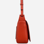 Side view of the Westwell Lane Flame Small Flapover Cross Body Bag.