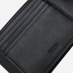 The BOSS logo embossed inside the BOSS Arezzo Grained Black Leather Trifold Wallet with Embossed Logo.