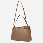 The shoulder strap and grab handle on the Beyond Beige Grained Leather Tote Bag with Double 'B' Monogram.