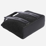 The base of the BOSS Becky Black Raffia Mini Tote Bag with Zip.
