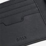 The embossed BOSS logo inside the BOSS Lewys Black Faux Leather 8CC Bifold Wallet with Metal Logo.