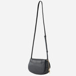 The cross body strap on the BOSS Salley Black Saddle Bag with Metal Logo.