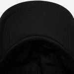 Underneath the peak of the Paul Smith Women's Black Nylon 'Floral Street' Cap with Embroidered Shop Address.