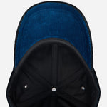 Underneath the peak of the Paul Smith Black Corduroy Cap with Signature Stripe Adjustable Strap.