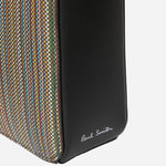 The embossed Paul Smith logo on the side of the Paul Smith Signature Stripe Coated Canvas Flight Bag.