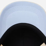 Underneath the peak of the Paul Smith Women's Ecru Washed Cotton Cap with Sun Logo.