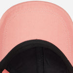 Underneath the peak of the Paul Smith Women's Pink Cotton Baseball Cap with Striped Zebra Logo.