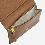 Zipped pocket of the Oak Street Saddle Brown Leather Medium Flapover Purse.