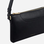 Side view of the Pockets Black Mini Zip Top Shoulder Bag.