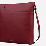 Side view of the Pockets Carmine Red Leather Large Zip Top NS Cross Body Bag.