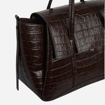 Side view of The Chancery Dark Oak Faux Croc Medium Flapover Shoulder Bag.