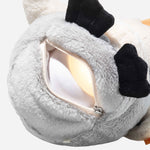 The open zip for the night light, at the base of the Steiff Light at Night 22 cm Lio the Penguin.