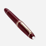 The Montblanc emblem on the Burgundy Red Meisterstück Classique Rollerball Pen.