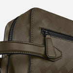 Close up of the front zip pocket and grab handle of the Montblanc Extreme 3.0 Khaki Leather Clutch Wash Bag.