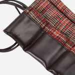 The WOLF logo embossed inside the WM Brown Faux Leather and Tweed Watch Roll Out with 6 Wraps.