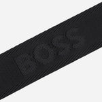The BOSS logo on the adjustable cross body strap of the BOSS Zair NS Zip Black Cross Body Bag with White Logo.