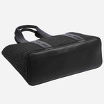 The base of the BOSS Becky Black Raffia Tote Bag with Embossed Hugo Detailing.