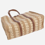The base of the BOSS Beyond Raffia Tote Bag with Brown Trims and Double 'B' Monogram Logo.
