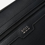 The BOSS logo on the front of the BOSS Lewys Black Faux Leather Zip Document Case with Metal Logo.