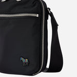 The signature stripe zebra logo on the front of the Paul Smith Black Recycled Polyester Small Flight Bag with Signature Stripe Zebra Logo.