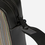 The Paul Smith logo on the zip puller on the Paul Smith Signature Stripe Coated Canvas Flight Bag.