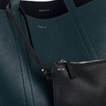 The zipped leather pouch of the Hanbury Row Black Large Reversible Open Top Tote Bag.