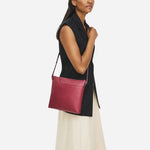 The Pockets Carmine Red Leather Large Zip Top NS Cross Body Bag by Radley.