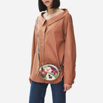 The adjustable cross body strap on the Radley RHS Orchid House Small Leather Ziptop Cross Body Bag.
