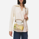 The Radley Spring Blooms Raffia and Leather Small Open Top Cross Body Bag with detachable and adjustable cross body strap.