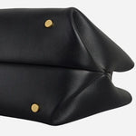 Metal feet on The Compton Black Small Zip Top Multiway Bag.
