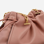 The detachable chain strap on the Radley The Roxburgh Carnation Leather Small Chain Clutch Bag.