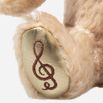 Music note on the foot of the Steiff Limited Edition 100th Anniversary 20 cm Disney Winnie the Pooh.