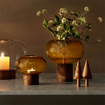 lsa oblate small amber vase with walnut base lifestyle