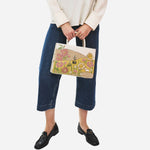 The grab handles on the Radley Spring Blooms Raffia and Leather Medium Ziptop Multiway Bag.