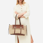 The slim, padded shoulder straps on the Radley The Chancery Natural Woven Raffia Medium Flapover Shoulder Bag.