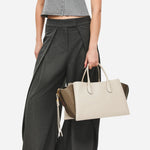 The grab handles on the Radley The Romilly Salt Leather Large Ziptop Multiway Bag.