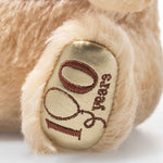 100th anniversary design on the foot of the Steiff Limited Edition 100th Anniversary 20 cm Disney Winnie the Pooh.