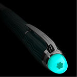 The glowing cap of the Polar Green StarWalker Precious Resin Fountain Pen in low light.